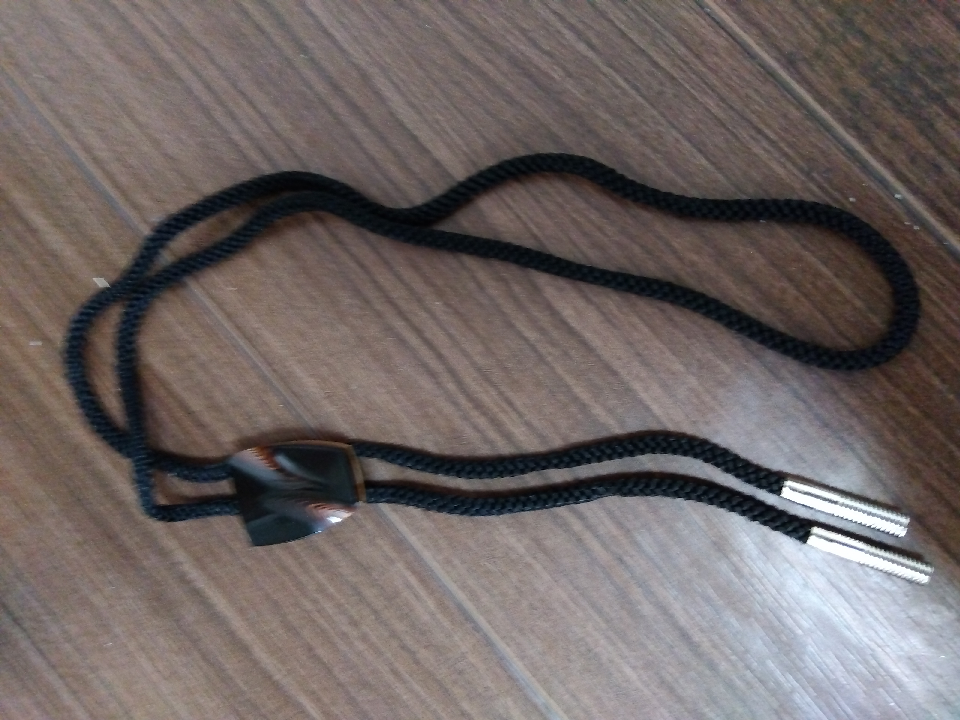Loop tie. It is made with a traditional Japanese technique called tsuishu.