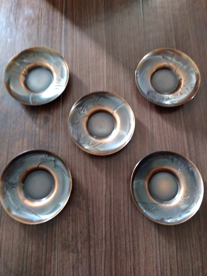 Set of 10 saucers. Tea utensils. The round ones are made of copper. The diamond-shaped ones are made of brass.