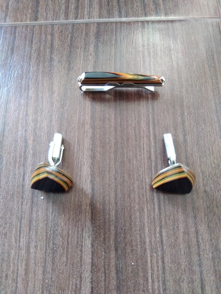 Set of necktie pin and cufflinks in Tsuishu. Tsuishu is a traditional Japanese technique.