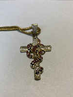 Necklace with a snake coiled around a cross.